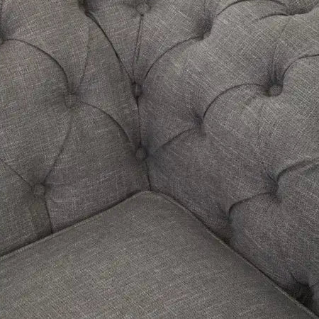 Introducing our classic chesterfield two-seat sofa, featuring a button-tufted back that exudes luxury with a touch of warmth. Timeless and elegant, it boasts gently scrolled arms that complement its smooth lines. The nail head trims add a finishing touch to the design, making this sofa a sophisticated addition to any living space.