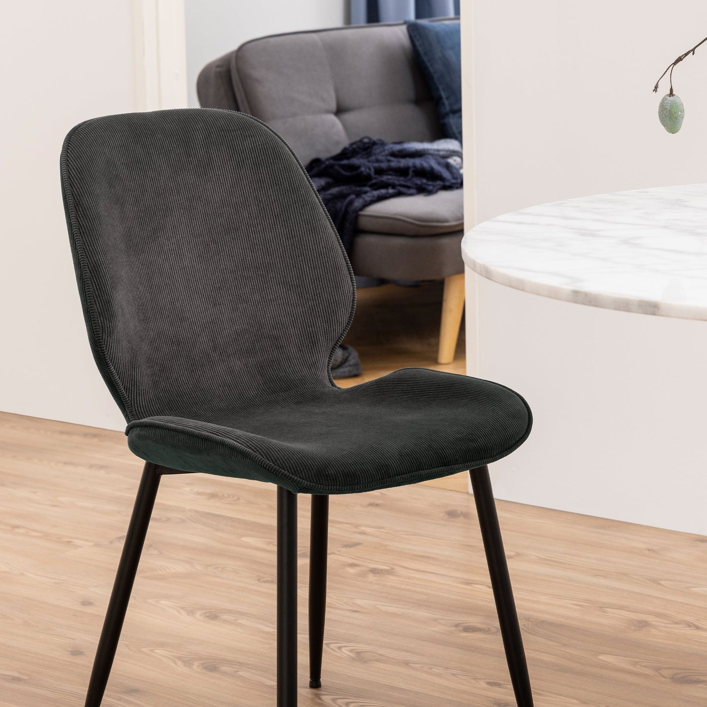 Stylish set of 4 corduroy dining chairs featuring a textured fabric design and comfortable seating, perfect for adding a touch of warmth and modern charm to any dining room or contemporary space