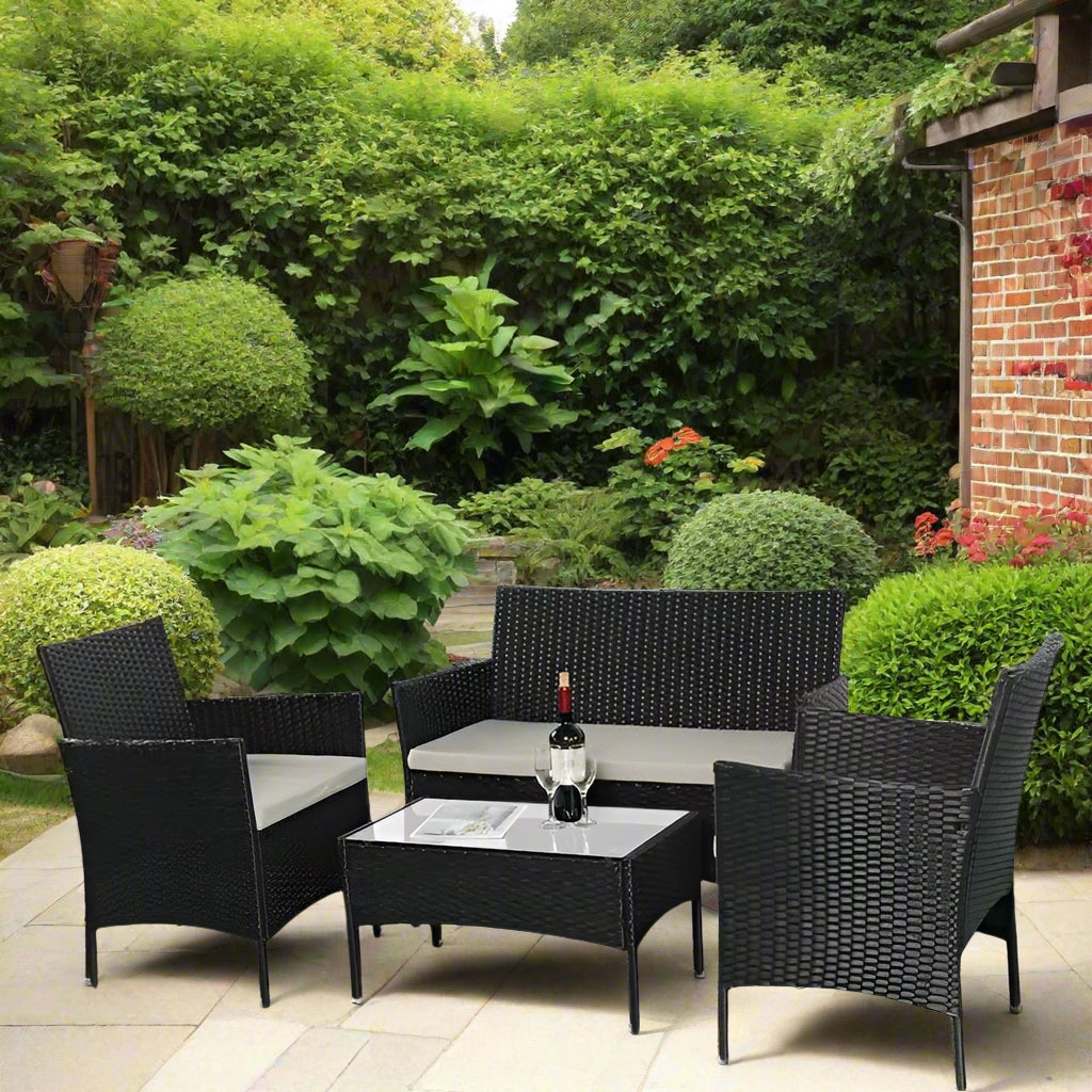 Amazon 4-piece rattan garden furniture set with grey cushions, featuring two chairs, a sofa, and a coffee table with tempered safety glass, made from weather-resistant PE rattan and coated metal frame, perfect for outdoor and indoor use.