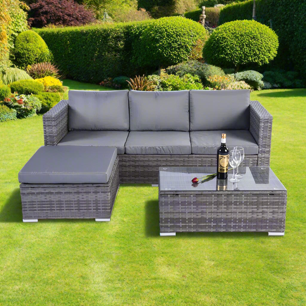 Rattan corner sofa set with contrasting colors, featuring a sofa, stool, and rectangular coffee table with a tempered glass top, made from durable PE rattan and all-weather fabric. Perfect for modern or contemporary gardens.