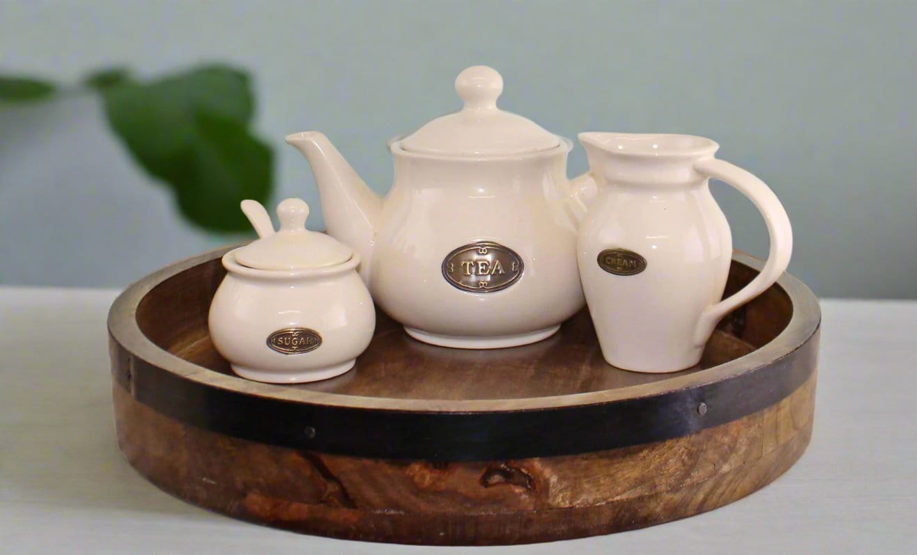 A Dark Wood Circular Serving Tray featuring a sleek, round design with a rich, dark wood finish. This elegant serving tray is perfect for serving drinks, appetizers, or organizing small items. The smooth, durable surface adds sophistication to any dining or living space, while the round shape enhances its stylish appeal. Ideal for both functional and decorative use, this dark wood tray complements modern, rustic, or traditional interiors, offering both practicality and charm to your home decor.