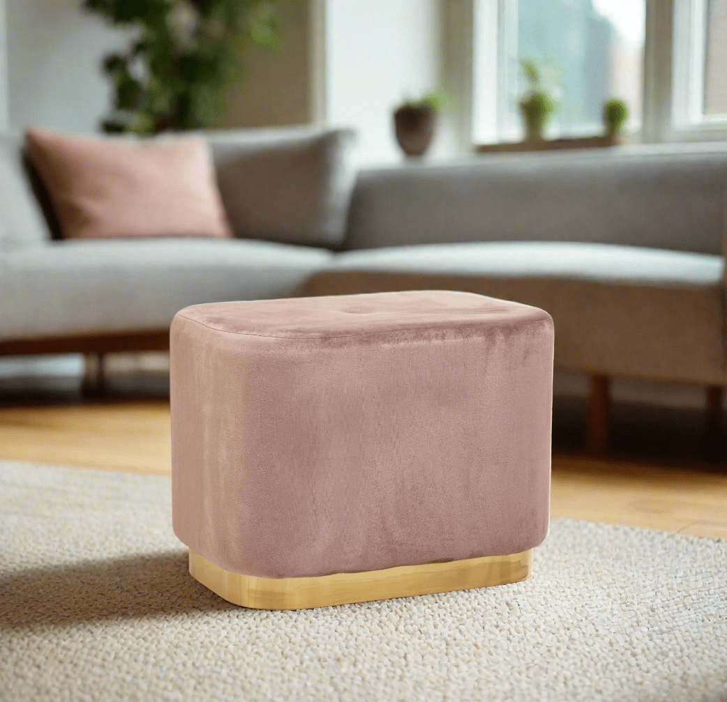 pink velvet stool with square design and matte gold finish base, offering a contemporary luxe style.