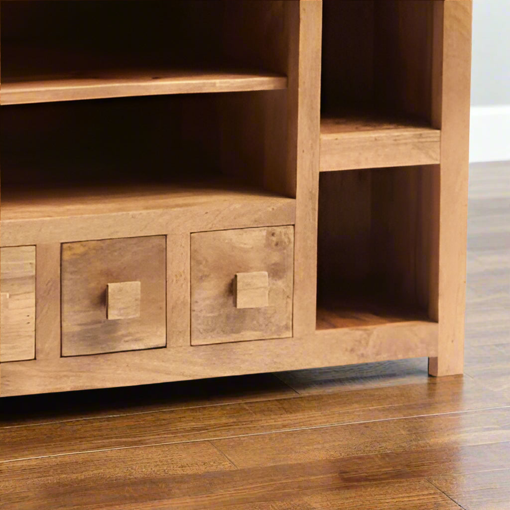 "The Natural Oak Wood Corner TV Stand combines contemporary style with sustainability. Crafted from 100% solid Mango hardwood and finished with a light oak stain, it highlights the wood’s natural beauty. Handcrafted using eco-friendly materials, this stand is both stylish and environmentally conscious. Its durable, timeless design makes it the perfect addition to any modern living room. Fully assembled and ready for use, this stand offers both practicality and elegance in one eco-friendly package."