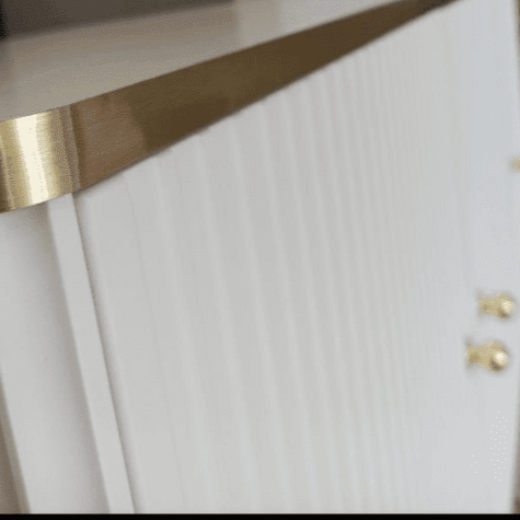 White and Gold Large Sideboard with a sleek white body, accented by elegant gold handles and edging. Features three doors with internal shelves for convenient storage. Easy to clean and maintain. Dimensions: 75cm H x 140cm W x 40cm D. Free delivery and easy assembly included.