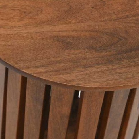 "Slatted round end/side table made from solid mango wood with a warm walnut finish, featuring a contemporary design with a tapered slatted base, fully assembled and easy to maintain."