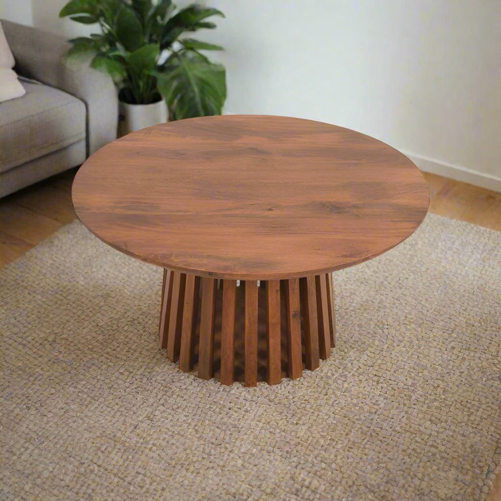"Round coffee table made from sustainably sourced mango wood with a unique slatted design, warm walnut finish, and easy partial assembly, perfect for adding sophistication or bohemian flair."