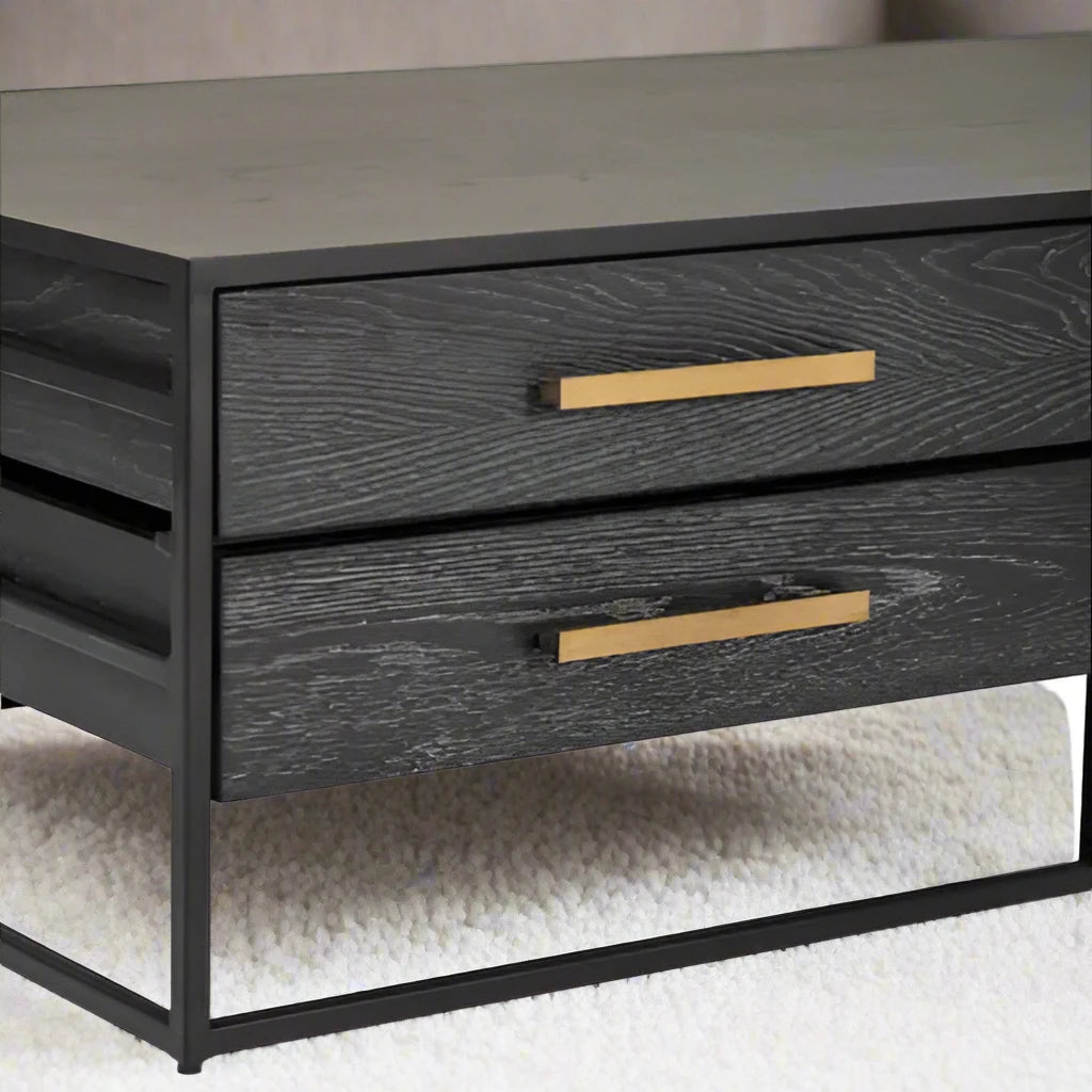 Black Wood 4 Drawer Coffee Table with sleek black wood veneer finish, gold finish handles, and angular black metal base. Ideal for modern living rooms, offering both style and storage. Dimensions: H40 x L70 x W120.