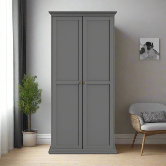 
A classic grey 2-door wardrobe featuring a sleek, timeless design with ample storage space for clothing and accessories. This wardrobe includes a hanging rail for garments and additional space for organizing items. The soft grey finish complements a variety of bedroom decor styles, adding a sophisticated and neutral touch to any space. Ideal for small or large bedrooms, this wardrobe combines functionality with classic charm, offering both organization and style. Perfect for contemporary or traditional int