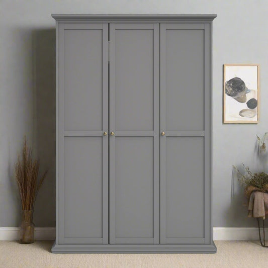 A Classic Grey 3-Door Wardrobe featuring a spacious design with three doors for ample storage. This wardrobe includes a hanging rail for clothes, shelves for accessories, and additional compartments for organizing items. The elegant grey finish adds a sophisticated, neutral touch to any bedroom decor, complementing both modern and traditional styles. Perfect for enhancing storage and organization, this 3-door wardrobe offers both functionality and timeless style for your home.