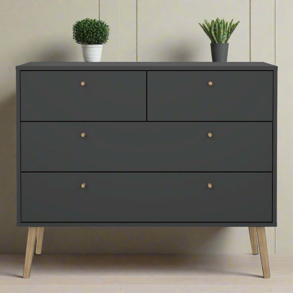 A sleek black oak chest of drawers featuring clean lines and a modern design, with ample storage space in its spacious drawers. The rich, dark oak finish adds a touch of sophistication, making it a stylish and functional addition to any bedroom or living space. Perfect for organizing clothes, accessories, or other essentials, this chest of drawers combines elegance and practicality.