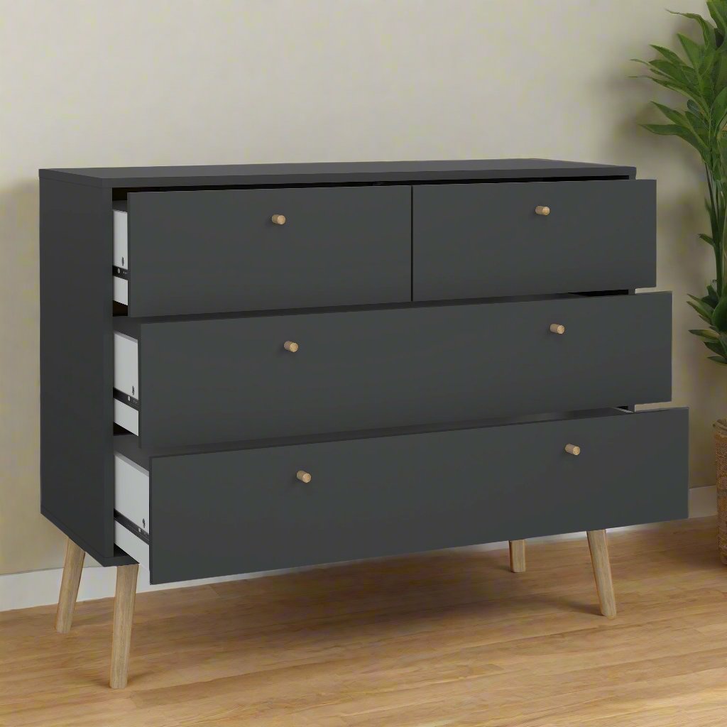 A sleek black oak chest of drawers featuring clean lines and a modern design, with ample storage space in its spacious drawers. The rich, dark oak finish adds a touch of sophistication, making it a stylish and functional addition to any bedroom or living space. Perfect for organizing clothes, accessories, or other essentials, this chest of drawers combines elegance and practicality.