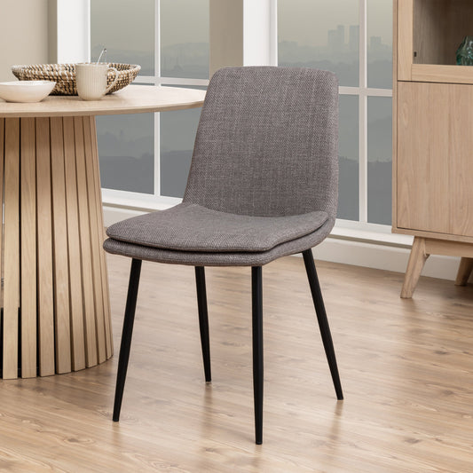 Elegant set of 4 brown upholstered dining chairs featuring a soft fabric finish and sturdy frame, perfect for adding comfort and sophistication to any dining room or modern space