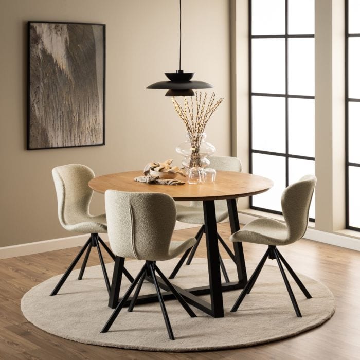 Set of two dining chairs with black steel swivel base, cream bouclé fabric upholstery, and zigzag stitching, featuring a modern Danish design.