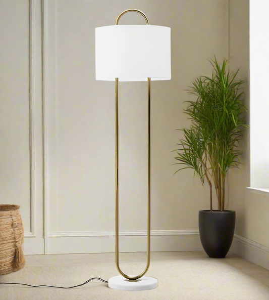 beautiful white and gold floor lamp adding a cosy chilled vibe to the room