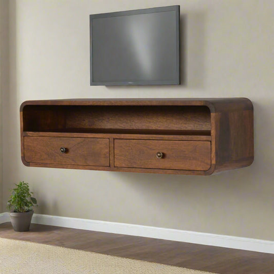 "Curved wall-mounted console table in chestnut finish, crafted from solid mango wood, with two drawers and a large open shelf for space-saving storage, part of the Curved Chestnut Collection."