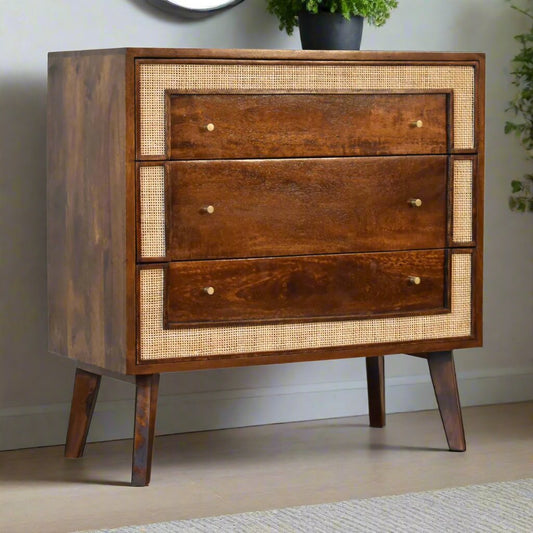 Chestnut Woven Chest with 3 spacious drawers, shiny knobs, and Nordic-style legs. Constructed from 100% solid mango wood with a chestnut finish and light woven rattan detailing for a beautiful contrast. Perfect for bedroom storage