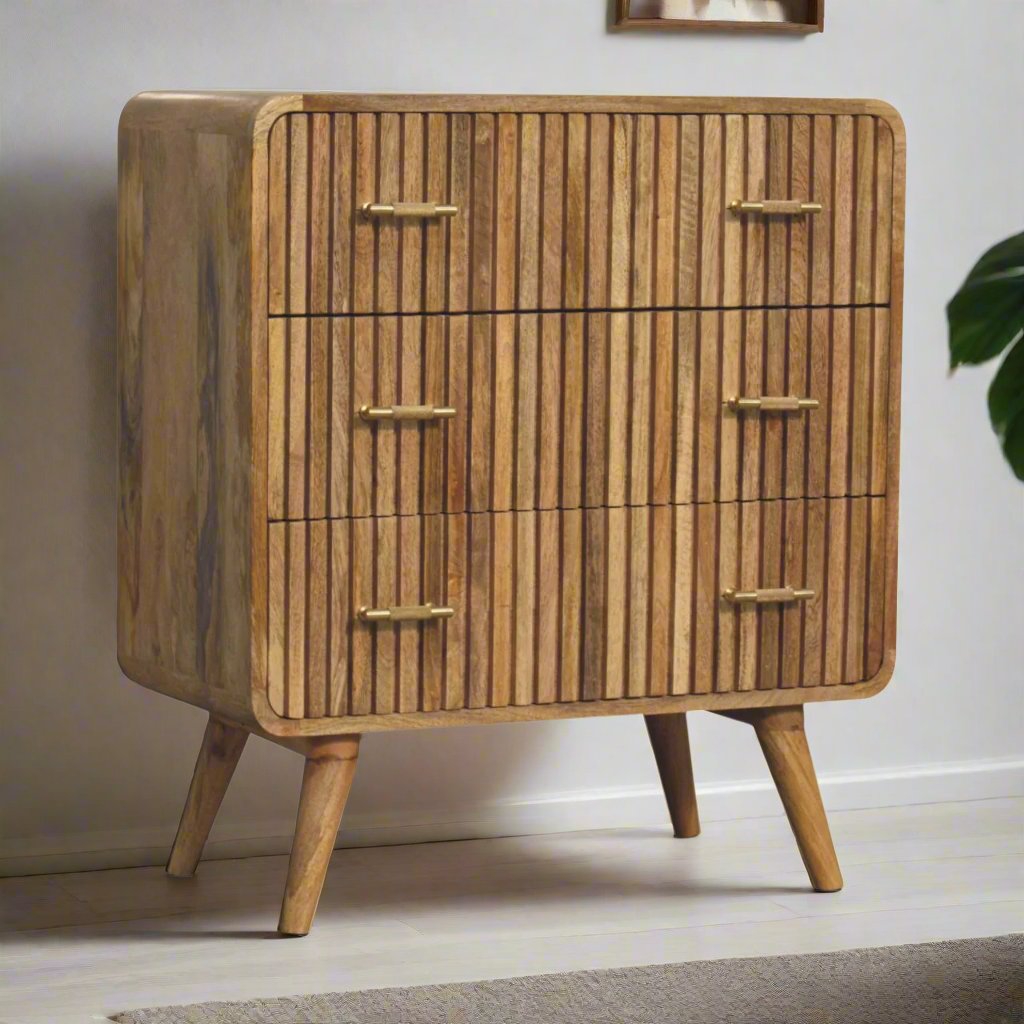 T-bar Ridged Chest made from solid mango wood with an oak-ish finish, featuring a ridged pattern, T-bar handles, and Nordic-style legs for a modern, stylish look.