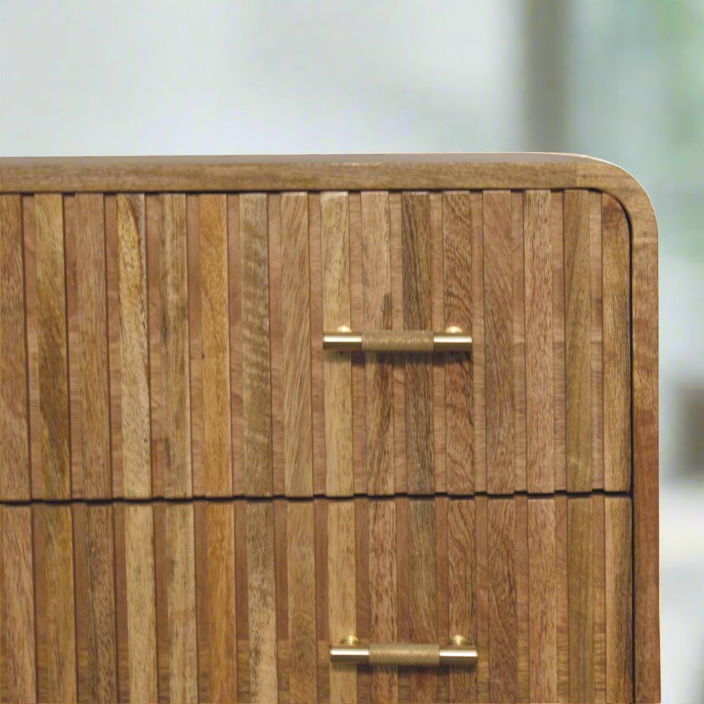 T-bar Ridged Chest made from solid mango wood with an oak-ish finish, featuring a ridged pattern, T-bar handles, and Nordic-style legs for a modern, stylish look.