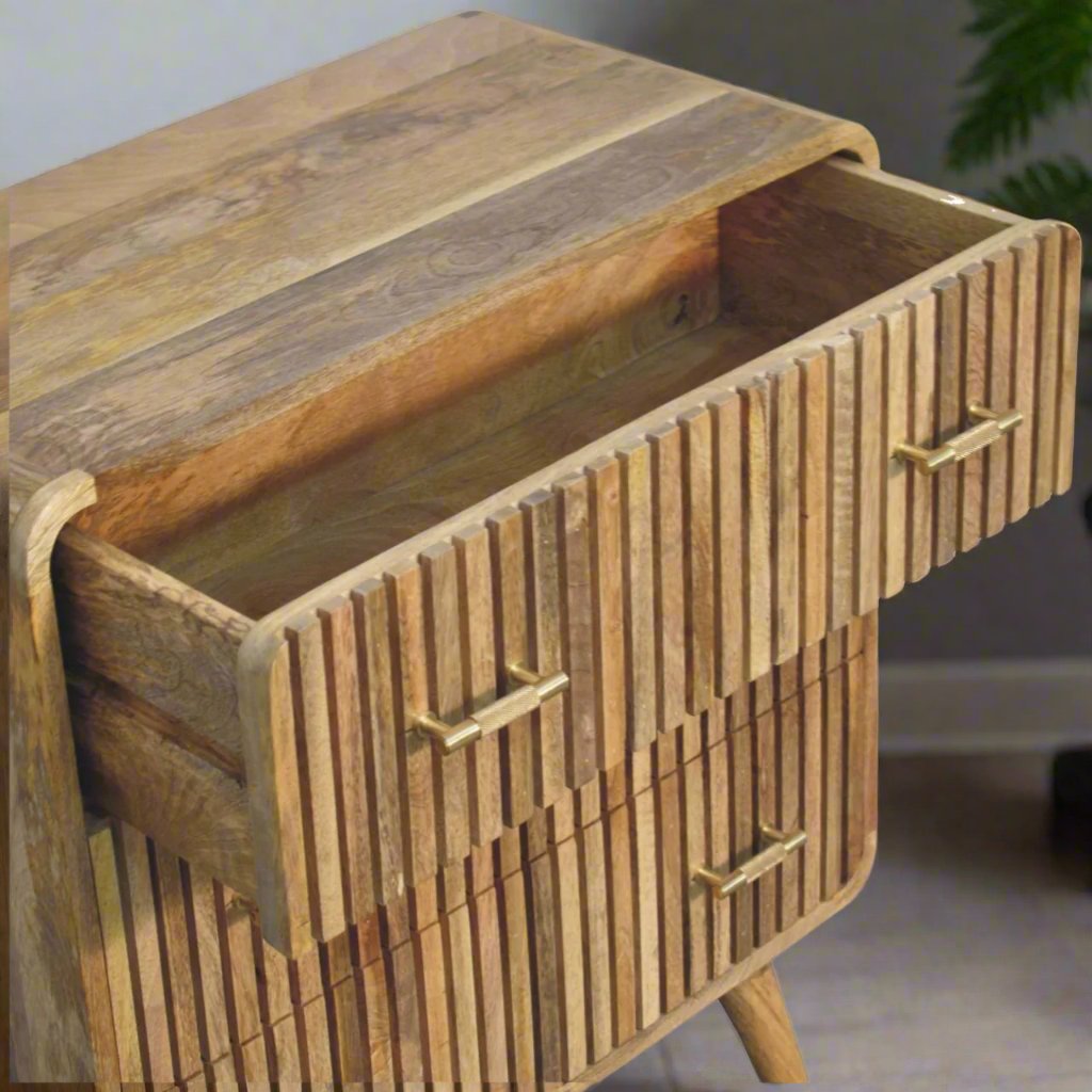 T-bar Ridged Chest made from solid mango wood with an oak-ish finish, featuring a ridged pattern, T-bar handles, and Nordic-style legs for a modern, stylish look.