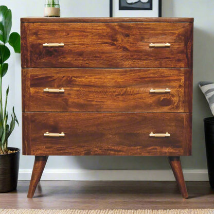 Gold detail chestnut chest of drawers made from solid mango wood with 3 spacious drawers, Nordic-style legs, and shiny gold T-bar handles