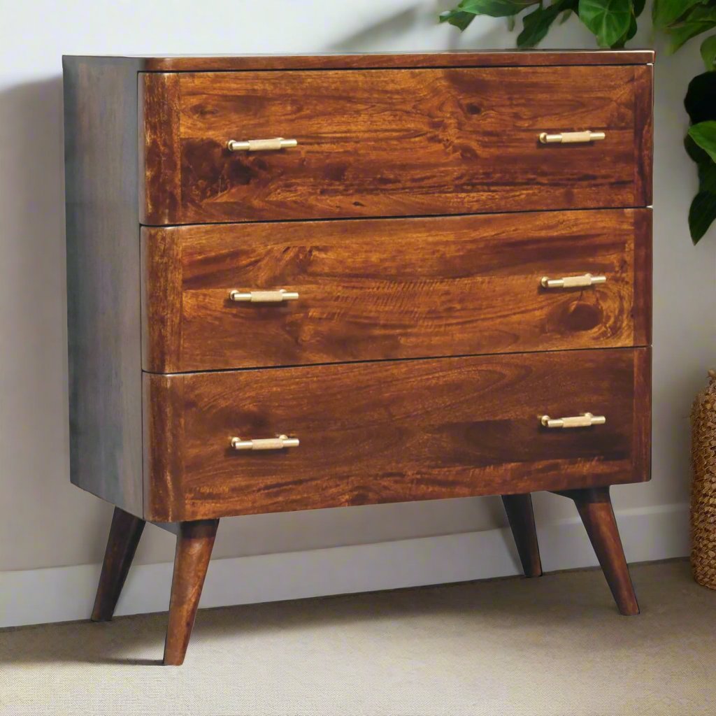 Gold detail chestnut chest of drawers made from solid mango wood with 3 spacious drawers, Nordic-style legs, and shiny gold T-bar handles