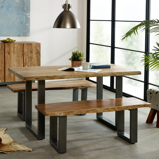 Enhance your dining space with the Solid Acacia Wood Dining Bench, featuring a live edge top that showcases eco-friendly wood. Measuring 175x40x45 cm (LxDxH), this bench offers ample seating and rustic charm. With fast, free delivery and easy leg assembly, it's perfect for family meals. Natural wood color variations make each bench unique. A matching table is available separately for a coordinated look. Upgrade your dining experience with this elegant, sustainable bench today!