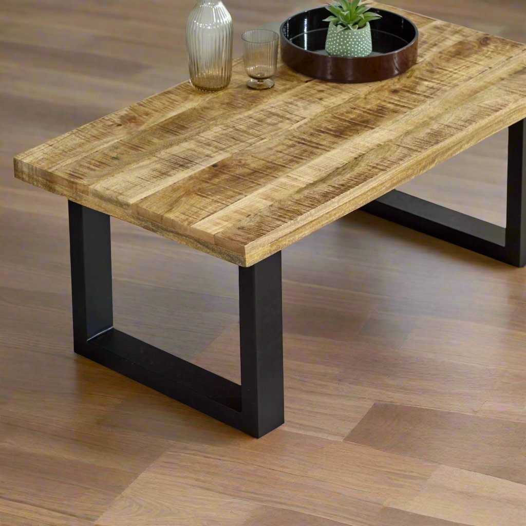 Add natural elegance to your living room with the Solid Acacia Wood Coffee Table, featuring a live edge top and eco-friendly craftsmanship. Measuring 45x115x60 cm (HxWxD), this sustainable table offers a spacious surface and unique wood grain patterns. Easy to assemble with only leg setup required, each table is one-of-a-kind due to natural wood color variations. Perfect for rustic or modern decor, this stylish coffee table comes with free delivery, combining beauty, sustainability, and affordability.