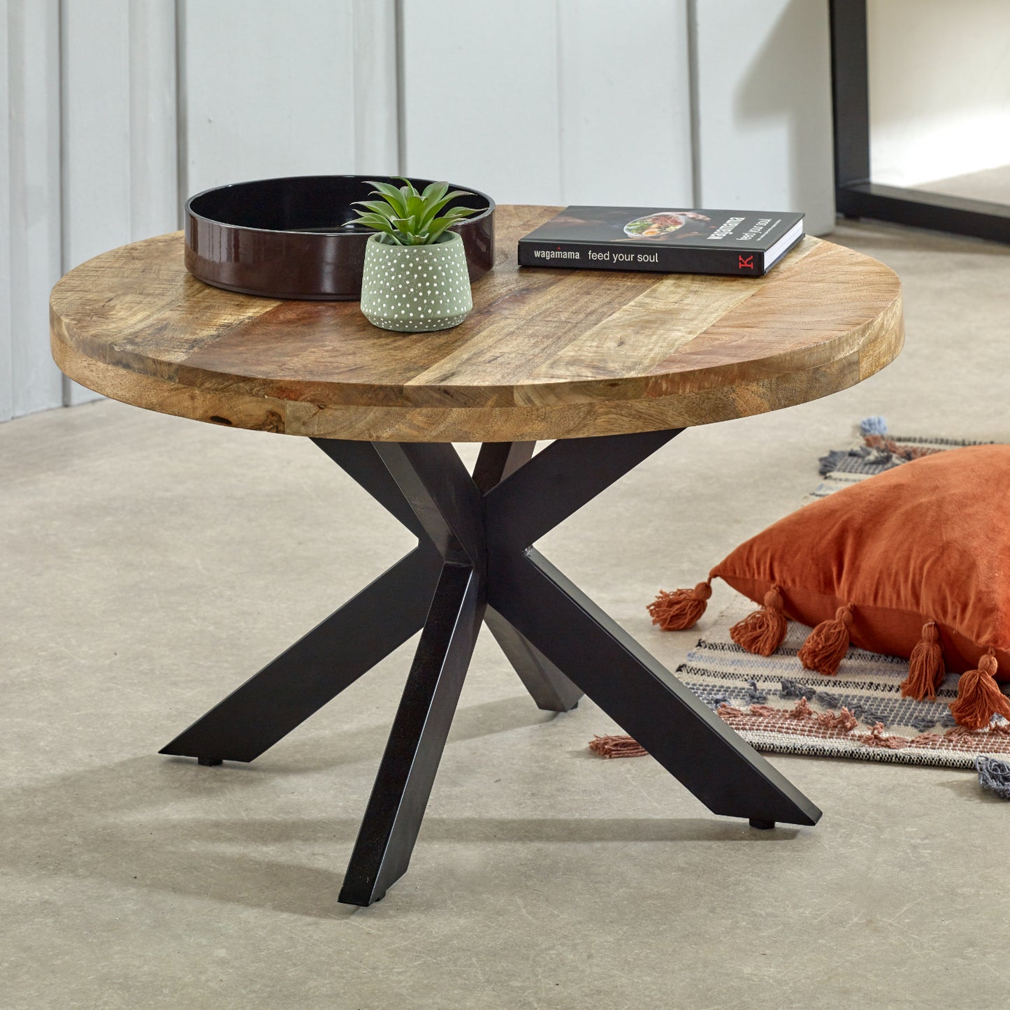 Stylish mango wood round coffee table with a natural finish, featuring a sturdy base and smooth tabletop, perfect for adding a rustic and warm touch to any living room or modern decor