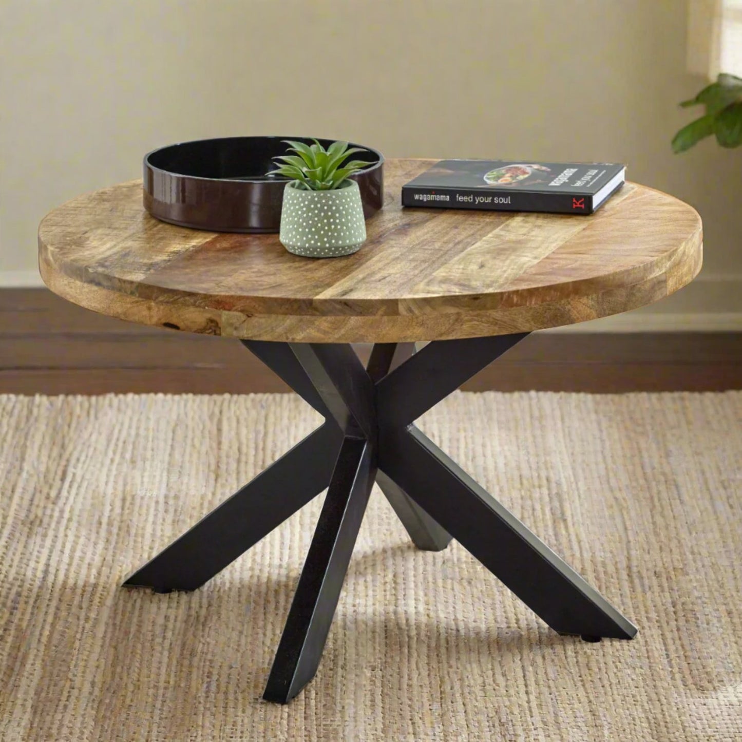 Stylish mango wood round coffee table with a natural finish, featuring a sturdy base and smooth tabletop, perfect for adding a rustic and warm touch to any living room or modern decor