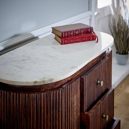 Elegant marble top chest of drawers featuring a sleek design with spacious storage drawers, offering a sophisticated blend of luxury and functionality for any bedroom or living room