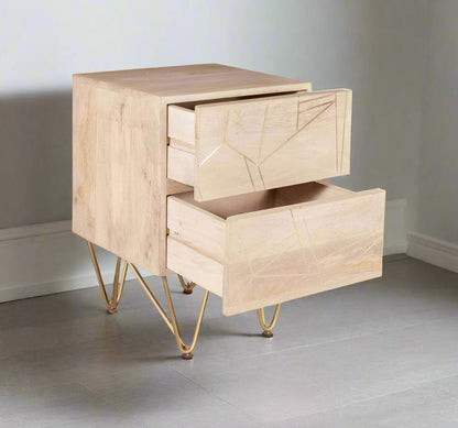 "Modern side table with two drawers, solid mango wood, gold metal inlays on drawer fronts, and angled metal legs, offering a blend of contemporary and retro vintage style."
