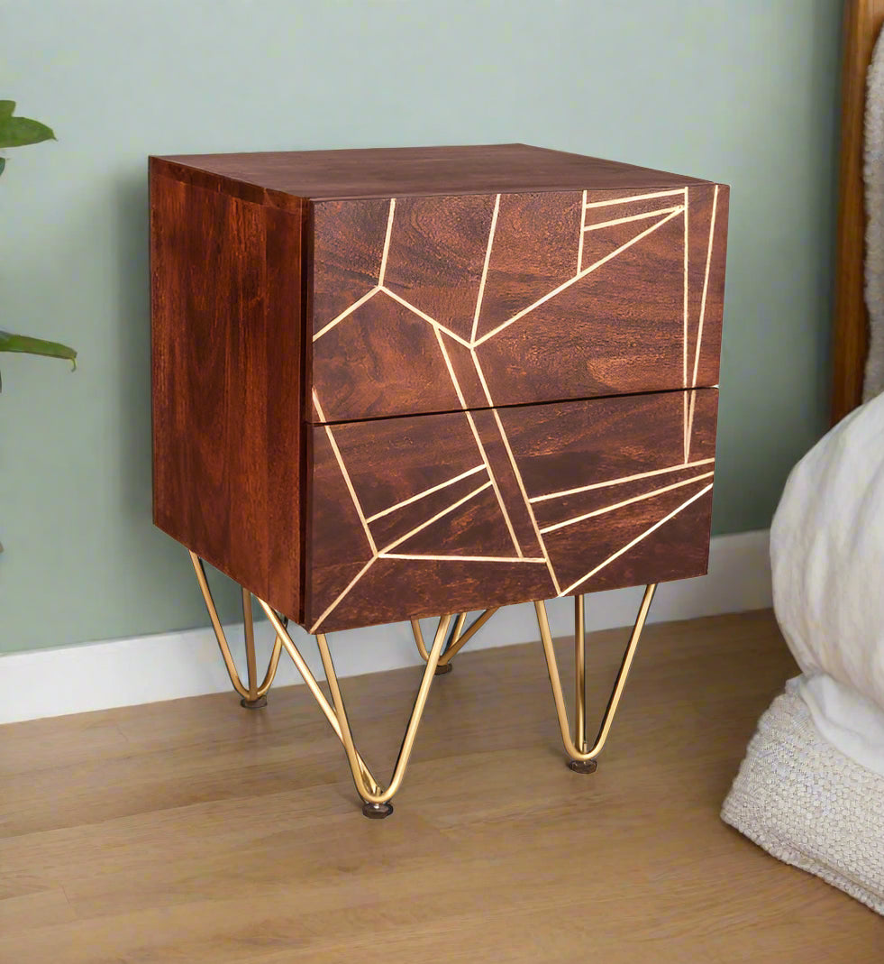 "Modern side table with two drawers, solid mango wood, gold metal inlays on drawer fronts, and angled metal legs, offering a blend of contemporary and retro vintage style."