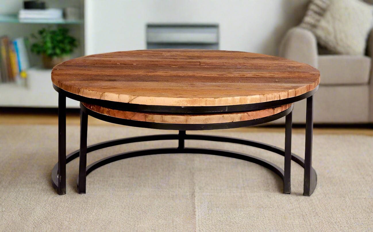 Set of two round coffee tables made from reclaimed railway sleepers with black metal frames, offering a stylish and eco-friendly design.