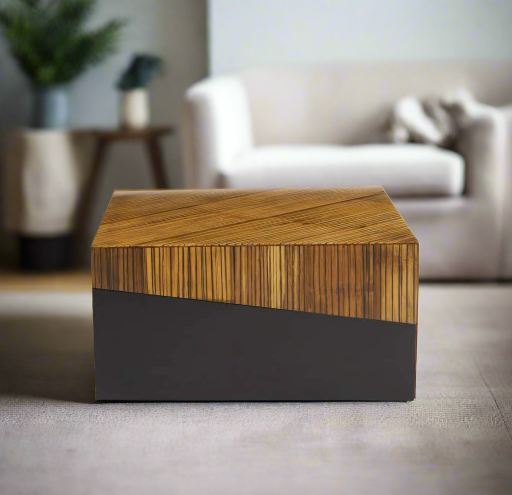 Natural bamboo coffee table with dark ebony finish base, featuring two tonal contrast and an angular intersecting line for a contemporary look.