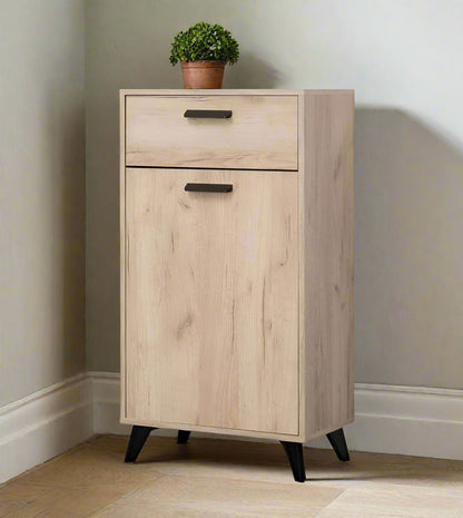 Small grey oak finish sideboard with black legs and handle, featuring one door and one drawer for versatile storage.