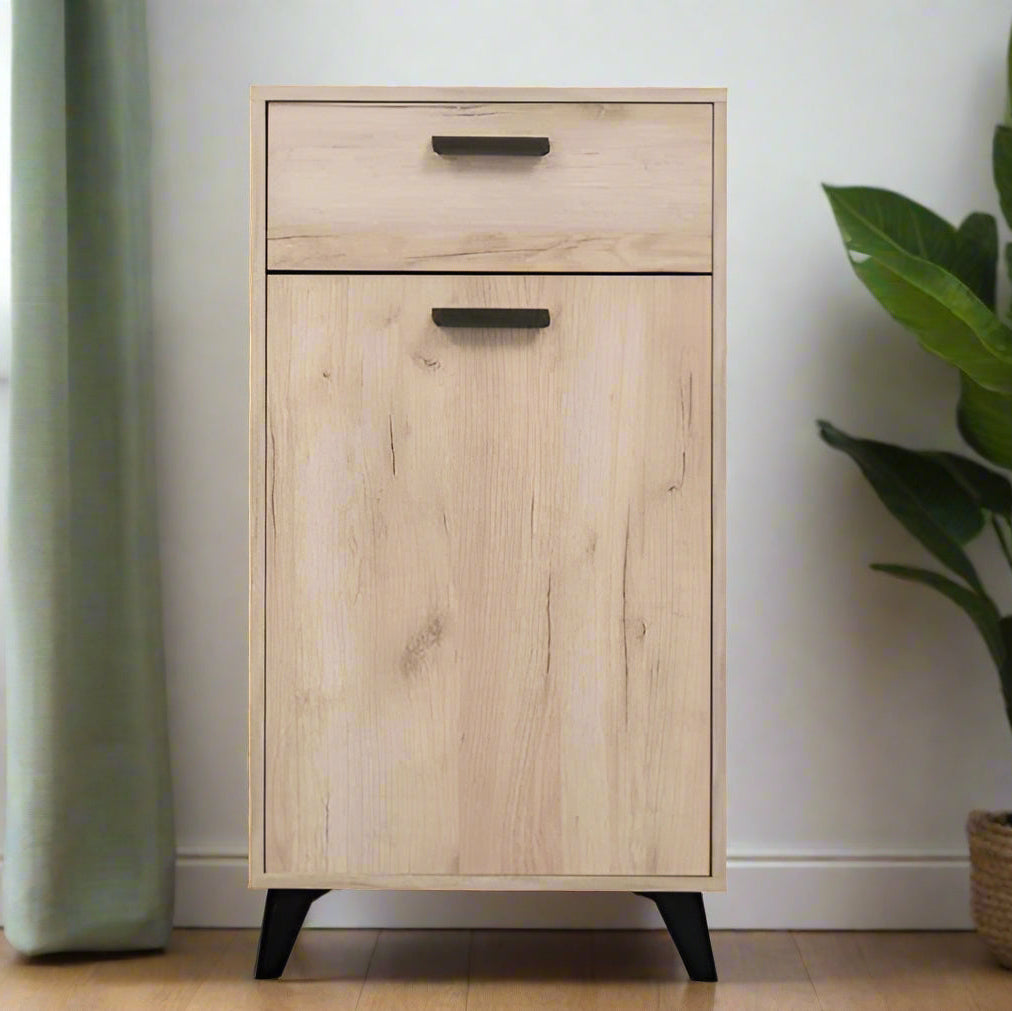 Small grey oak finish sideboard with black legs and handle, featuring one door and one drawer for versatile storage.