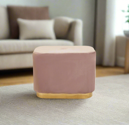 pink velvet stool with square design and matte gold finish base, offering a contemporary luxe style.