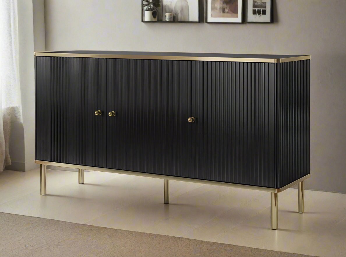 Black and Gold Large Sideboard with a sleek white body, accented by elegant gold handles and edging. Features three doors with internal shelves for convenient storage. Easy to clean and maintain. Dimensions: 75cm H x 140cm W x 40cm D. Free delivery and easy assembly included