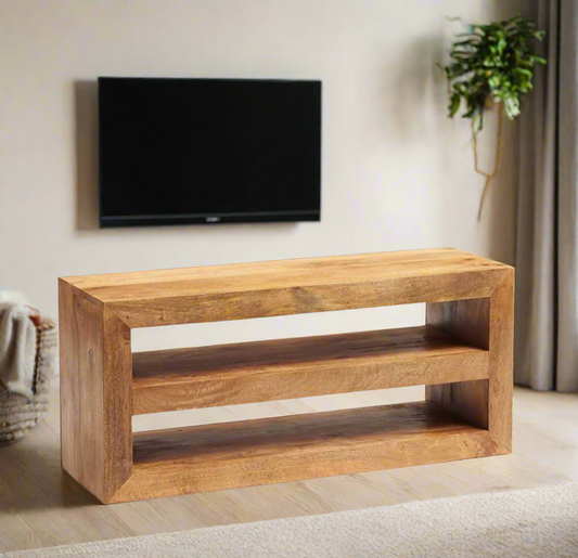 Enhance your living space with this beautifully crafted TV stand, made from 100% solid light Mango hardwood. The wood is lightly stained with a matte finish, allowing the natural beauty and warm tones of the wood to shine through. Featuring matching wooden handles, this eco-friendly piece is fully assembled and ready for use. With a focus on sustainability and craftsmanship, it brings both style and functionality to your home. Enjoy free delivery on this timeless, handcrafted TV stand.