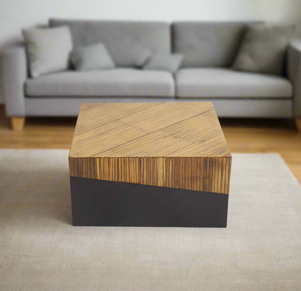 Natural bamboo coffee table with dark ebony finish base, featuring two tonal contrast and an angular intersecting line for a contemporary look.